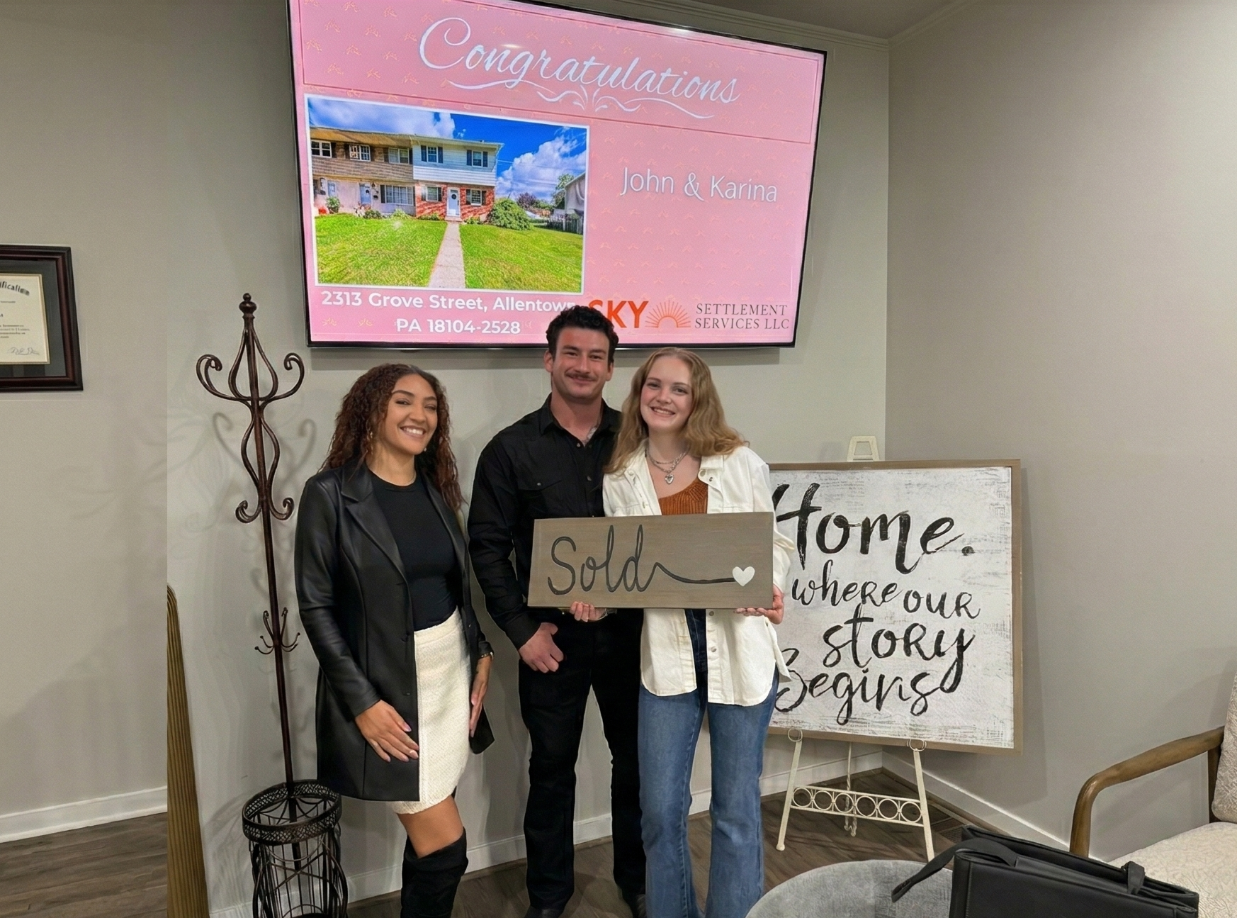 Cliff Lewis Experience agent closing a deal with first time home buyers